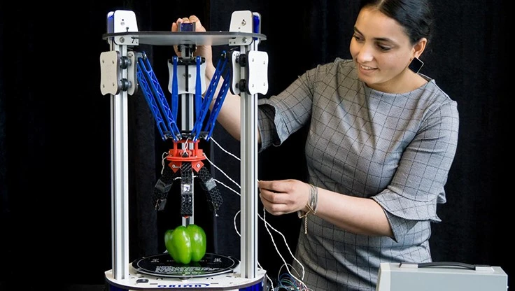 Simon Fraser University (SFU) PhD graduate Manpreet Kaur works in the field of soft robotics and demonstrates 3-D printed humanoid robot fingers.