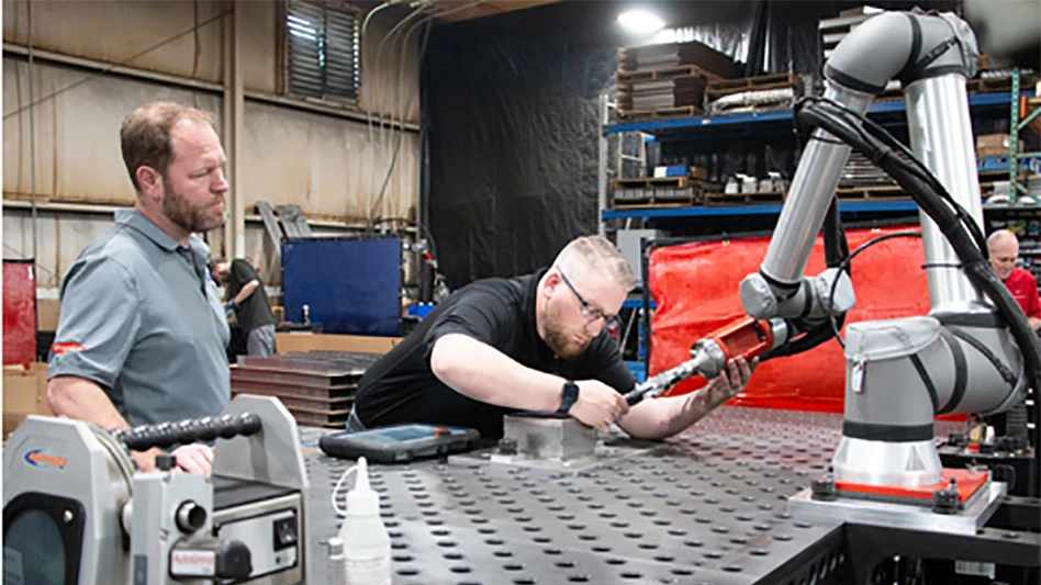 Turnkey systems for cobot welding, as seen here at sheet metal manufacturer Raymath in Ohio, is one of the solutions Universal Robots predicts will drive automation in 2023. Raymath’s CEO wrote the purchase order right after experiencing a hands-on programming demo.