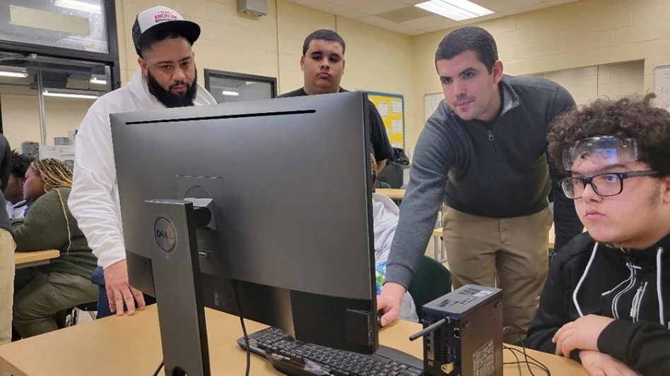 Andrew Crowe (left) and Yolexis Lima (bending) from Mastercam reseller Cimquest show students at Ben Franklin High School the features of Mastercam CAD/CAM software.