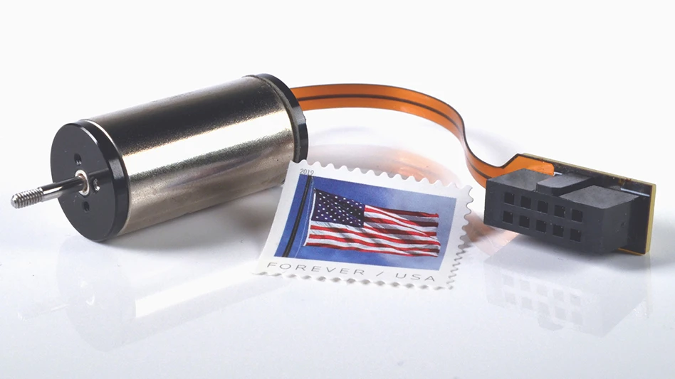 Image of Moticont’s SDLM-016-032-01-01-M (Metric) direct drive linear motor with an American flag